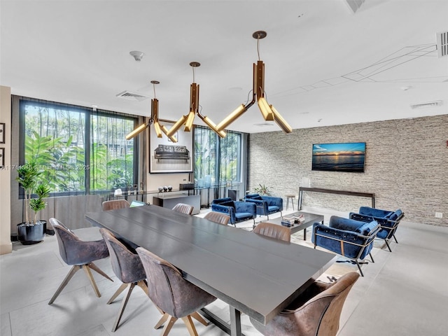 dining space with a wall of windows