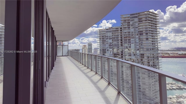 balcony featuring a water view