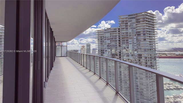 balcony featuring a water view