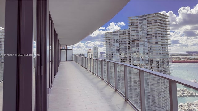 balcony featuring a water view