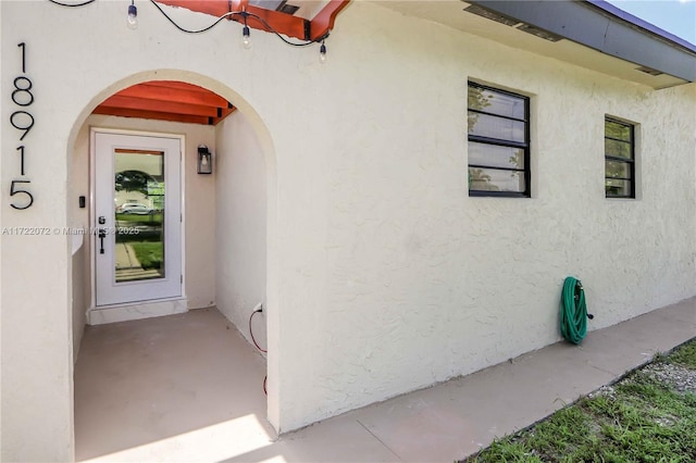 doorway to property featuring a patio area