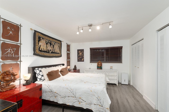 bedroom with hardwood / wood-style flooring