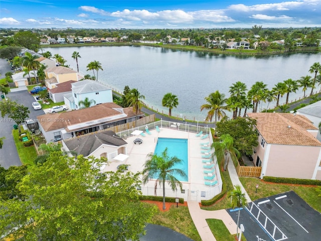 birds eye view of property with a residential view and a water view