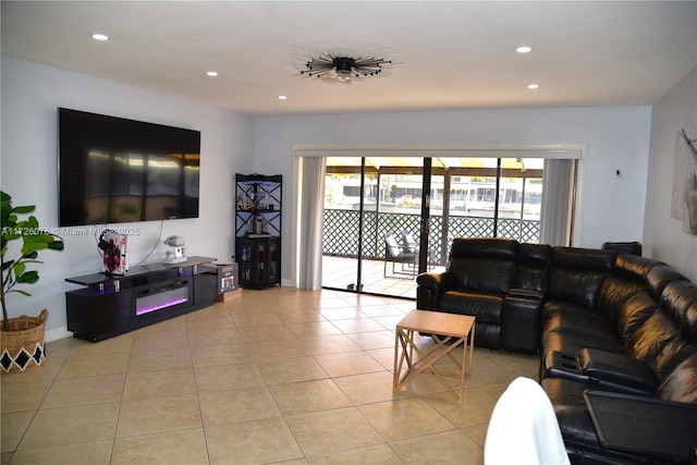 living room with light tile patterned floors, a wealth of natural light, and recessed lighting