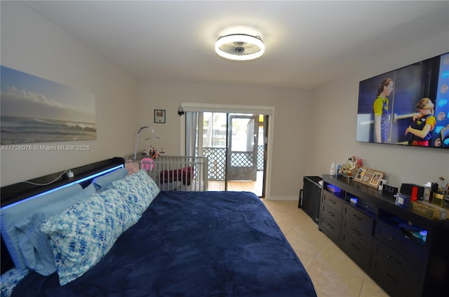 bedroom with access to outside and light tile patterned flooring