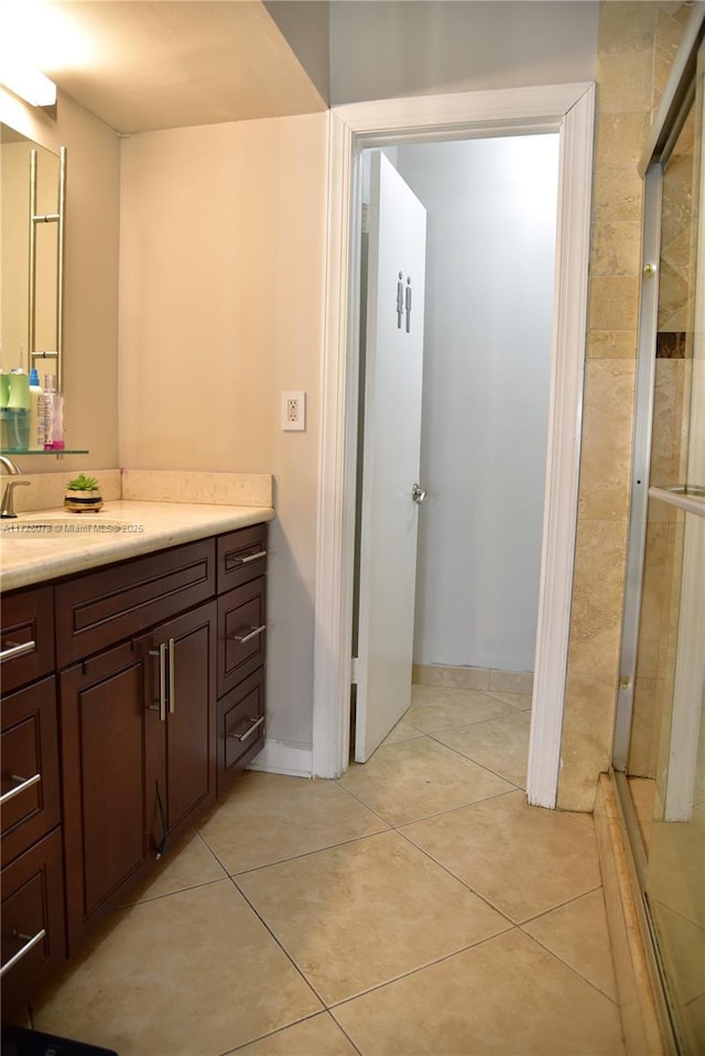 bathroom featuring tile patterned flooring and vanity