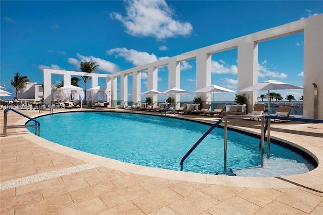 view of swimming pool featuring a patio