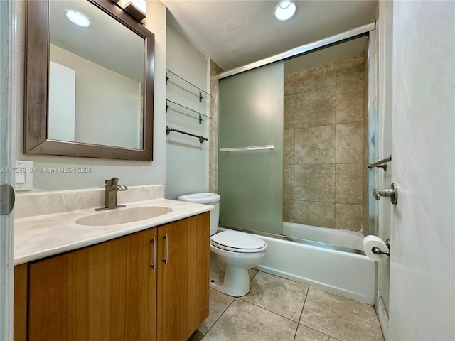 full bathroom featuring toilet, tile patterned flooring, vanity, and combined bath / shower with glass door