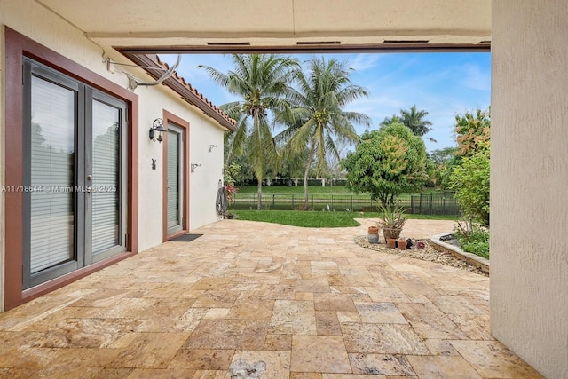 view of patio featuring fence