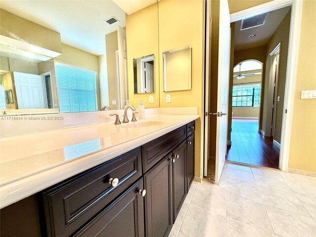8771 NW 41st St, Cooper City, FL 33024 - full bath featuring vanity, a bath, tile patterned floors, and recessed lighting