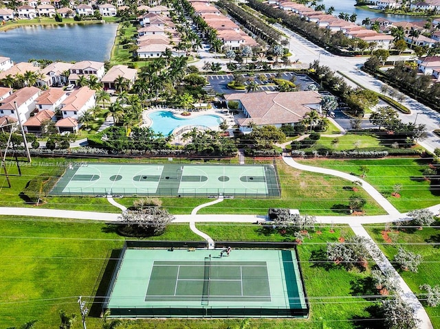 bird's eye view featuring a water view and a residential view