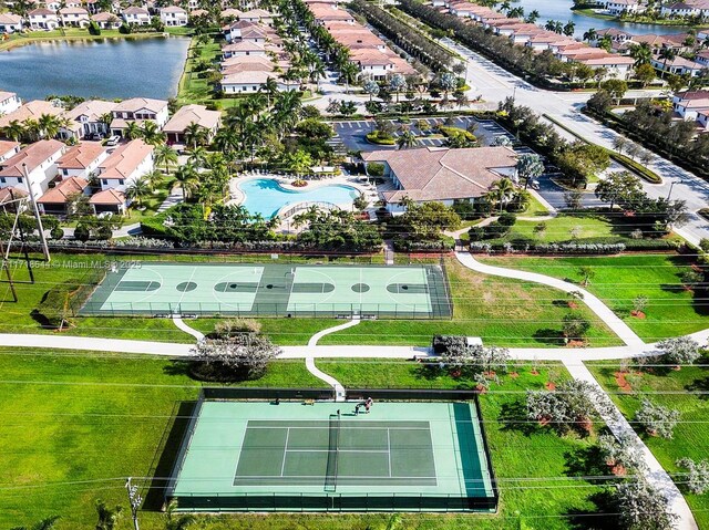 8771 NW 41st St, Cooper City, FL 33024 - aerial view of residential area with a nearby body of water and a pool area