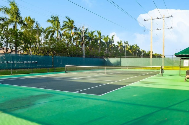 view of sport court featuring fence