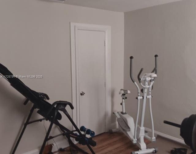 workout room featuring hardwood / wood-style flooring