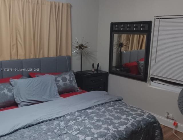 bedroom with wood-type flooring