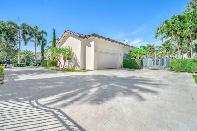 view of side of property with a garage