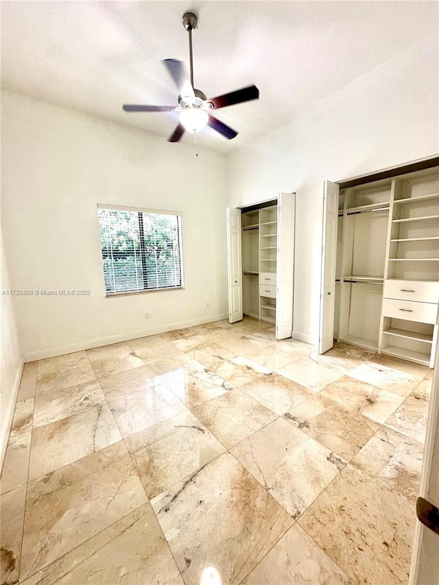 unfurnished bedroom featuring ceiling fan