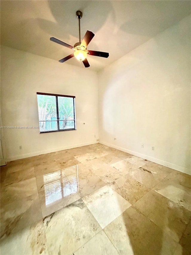 spare room with ceiling fan