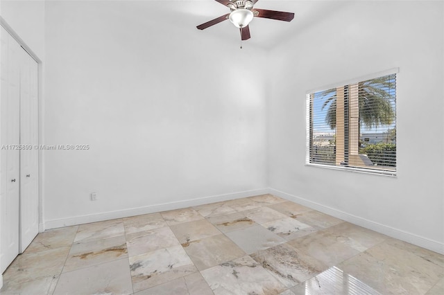 unfurnished room with ceiling fan