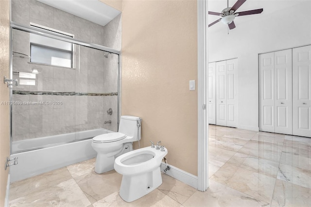 bathroom with a bidet, ceiling fan, shower / bath combination with glass door, and toilet