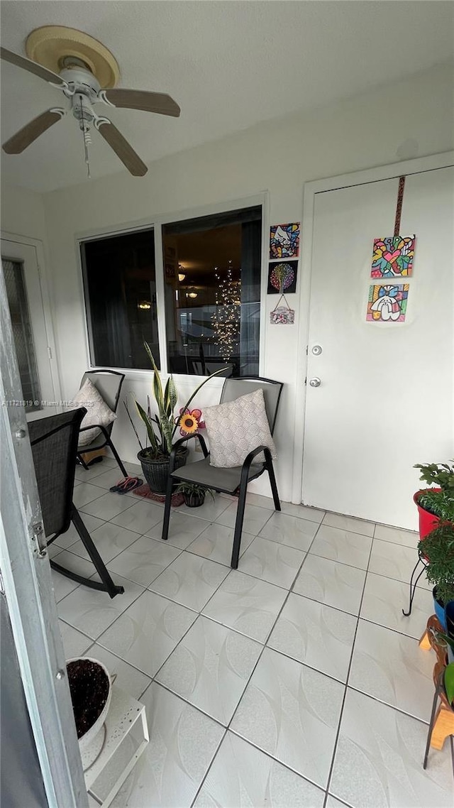 sunroom / solarium with ceiling fan