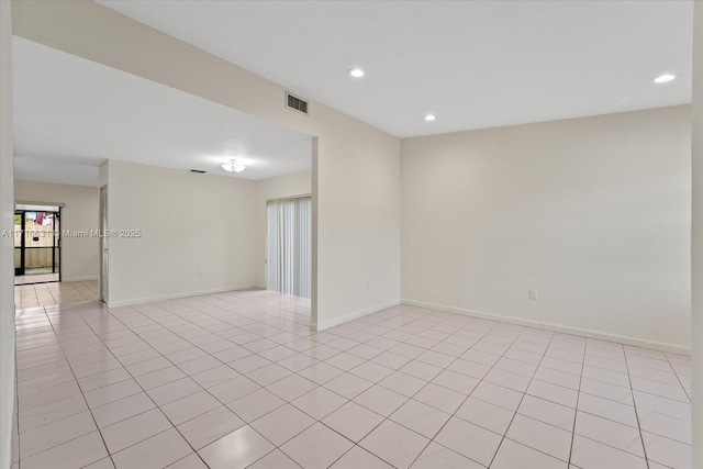 spare room featuring light tile patterned floors