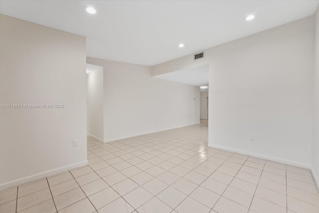 empty room featuring light tile patterned floors