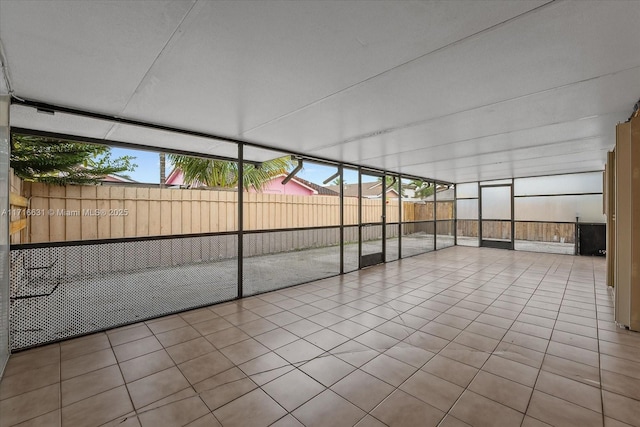 unfurnished sunroom featuring a wealth of natural light