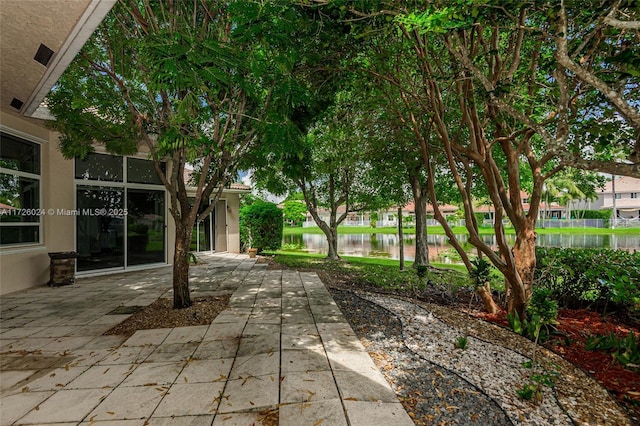 view of patio with a water view