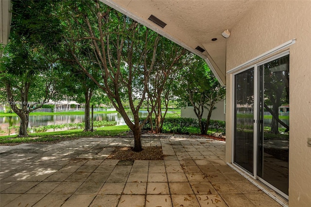 view of patio / terrace featuring a water view