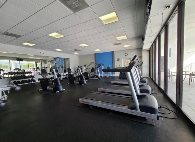 gym featuring a paneled ceiling