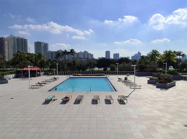 view of swimming pool featuring a patio area