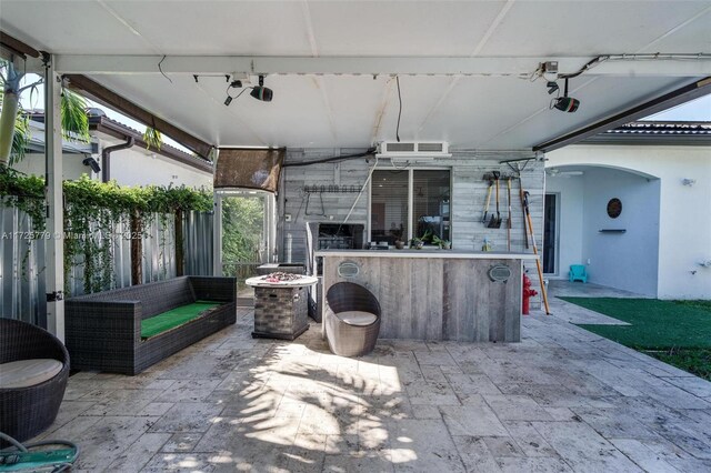 18253 SW 152nd Pl, Miami, FL 33187 - view of patio featuring an outdoor living space with a fire pit