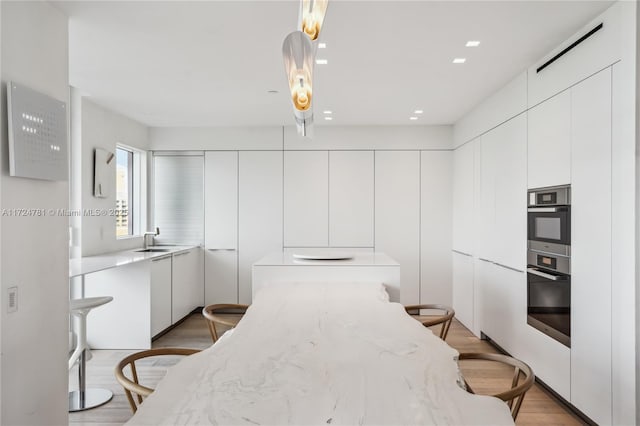 interior space featuring light hardwood / wood-style floors and sink