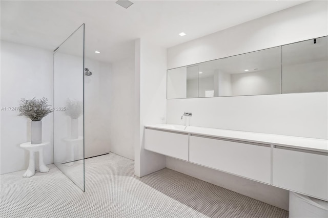 bathroom with vanity and walk in shower