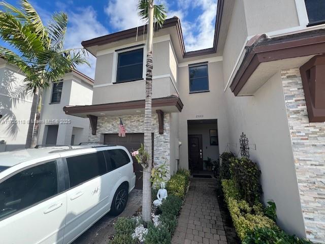 view of front of property with a garage