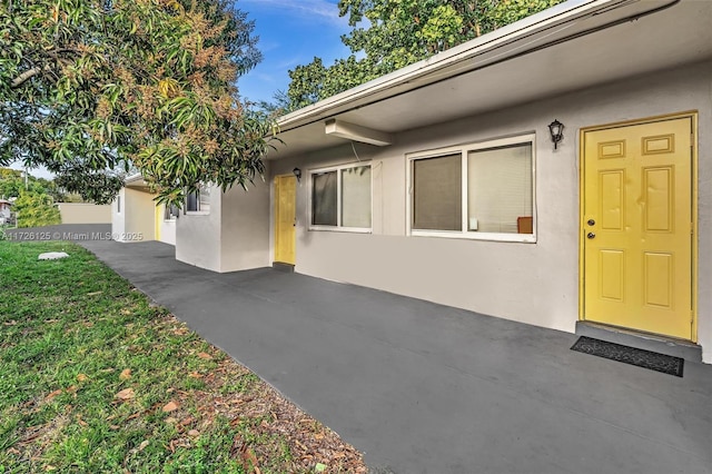 entrance to property with a patio