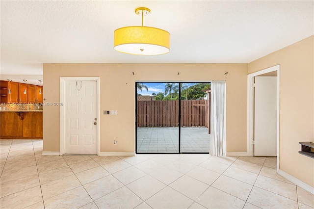 empty room featuring light tile patterned floors