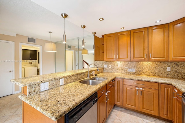 kitchen featuring decorative light fixtures, kitchen peninsula, sink, and stainless steel appliances