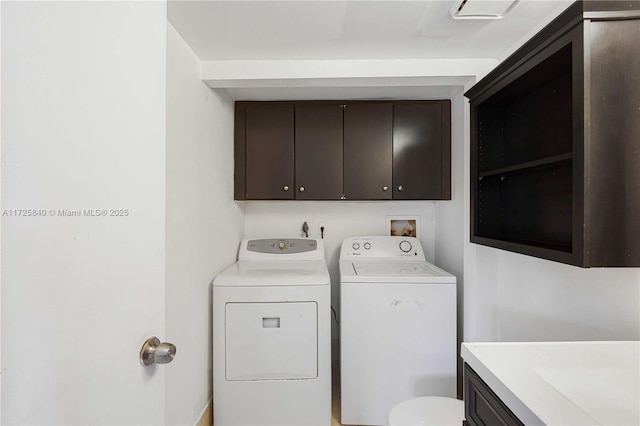 laundry area featuring washing machine and clothes dryer and sink