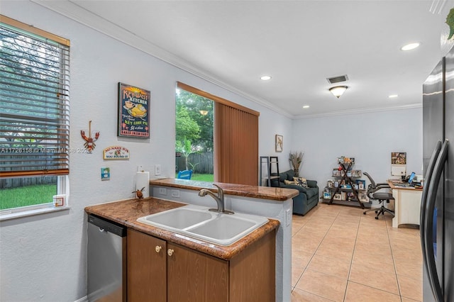 kitchen featuring kitchen peninsula, stainless steel appliances, crown molding, and sink