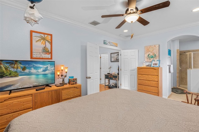 bedroom with ceiling fan, connected bathroom, and ornamental molding