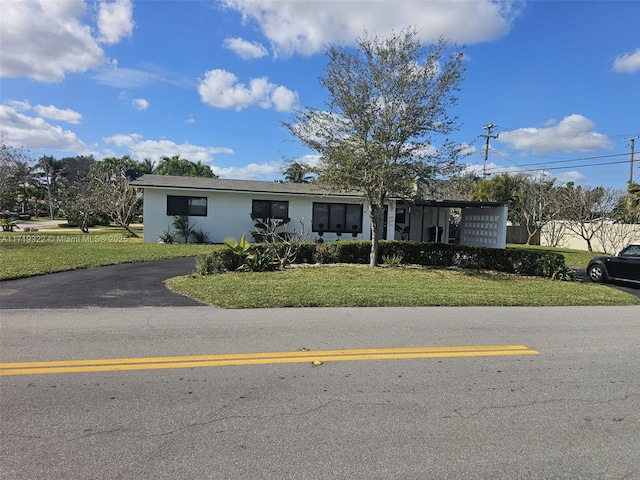 view of front of home with a front lawn