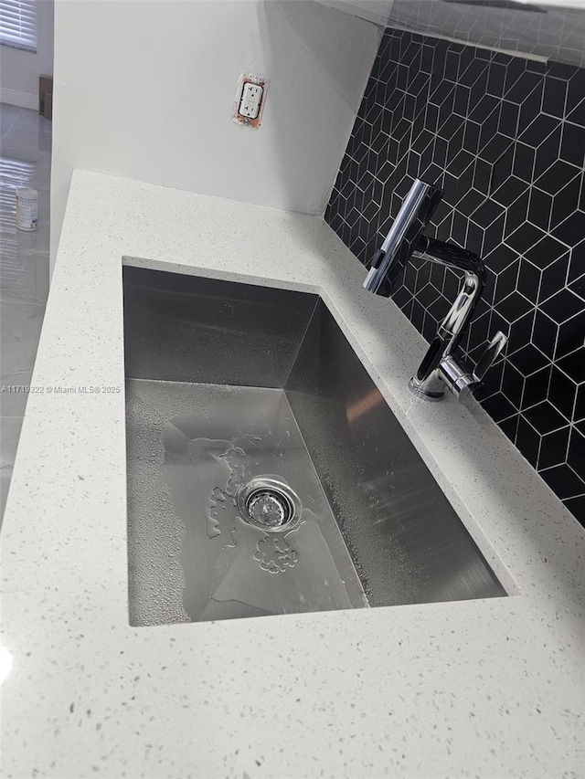 interior details with sink and light stone counters