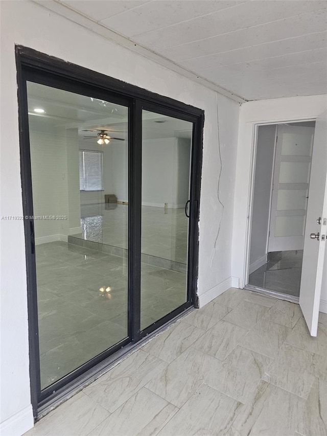 unfurnished room featuring ceiling fan and wooden ceiling