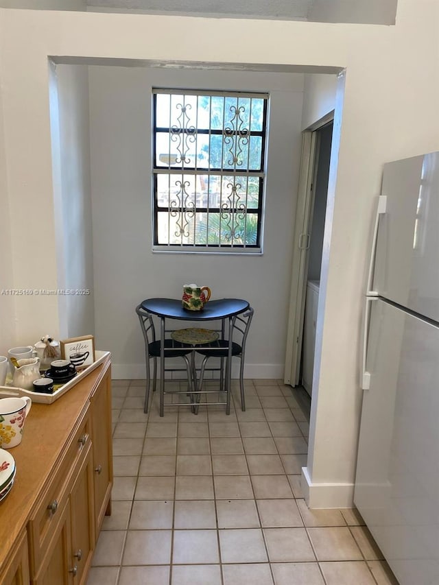 dining space with light tile patterned flooring