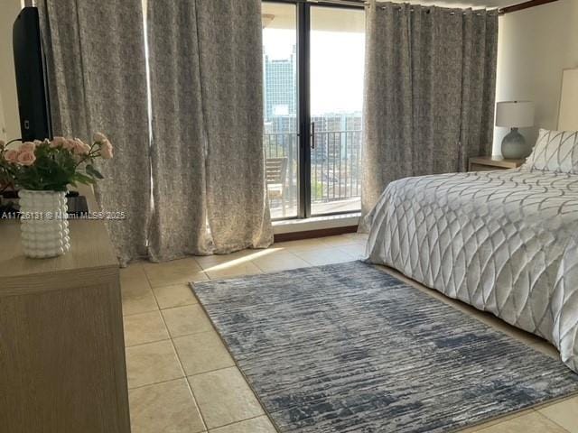 bedroom featuring light tile patterned floors