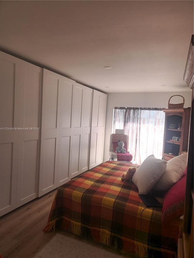 bedroom featuring hardwood / wood-style flooring