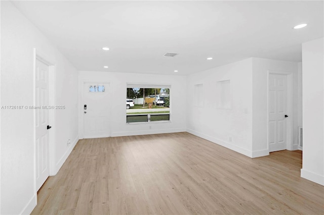 unfurnished living room with light wood-type flooring