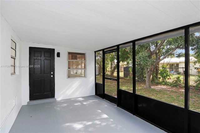 unfurnished sunroom with plenty of natural light